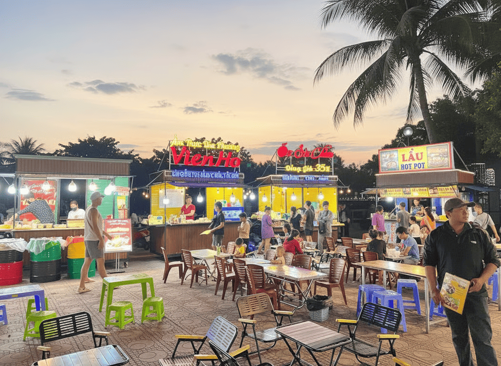 Eating at street-side stalls with tiny tables and chairs packed closely together is an incredibly unique experience